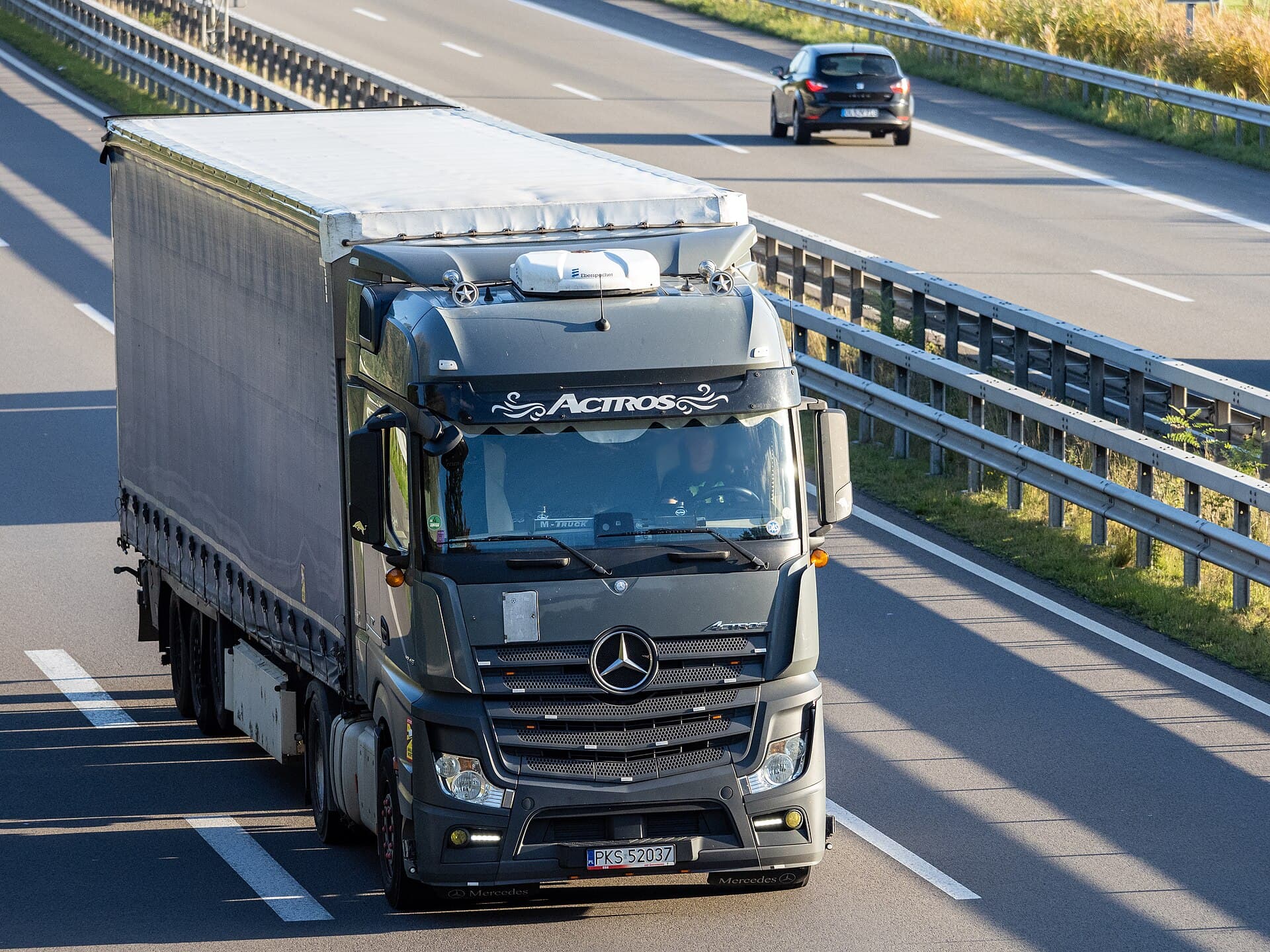 Tractor on the highway — the kind of truck we source cab and engine parts for
